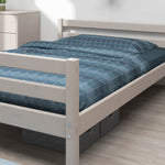 FLEXA single grey bed, 140x200 cm, blue geometric bedding, light wood minimalist bedroom, child-safe rounded edges.