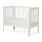 FLEXA NOVA baby bed safety rail in cream, modern slatted design, shown on white; child-safe feature visible.