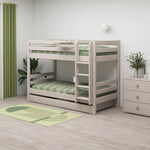 FLEXA light wood bunk bed with green bedding, grey bedside table, dresser and rug in a child’s bedroom.