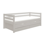 FLEXA grey single bed with pull-out underbed, storage drawers and safety rail, shown in a child’s bedroom.