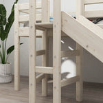 FLEXA white high bed with slide, short ladder, and safety rail from CLASSIC collection on wooden floor in child’s room.