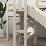 FLEXA white high bed with slide, short ladder, and safety rail from CLASSIC collection on wooden floor in child’s room.