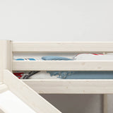 FLEXA WHITE high bed with slide and safety rail, 90x200 cm, in a child’s room; safe design with playful bedding.