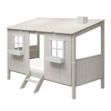 FLEXA WHITE house frame for single and midsleeper beds with two windows, ladder, and sloped roof, shown in a child’s bedroom.