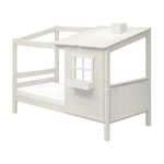 FLEXA WHITE single bed from the HOUSE collection with a ladder, slanted roof, window, and child-safe edges in a kids’ room.