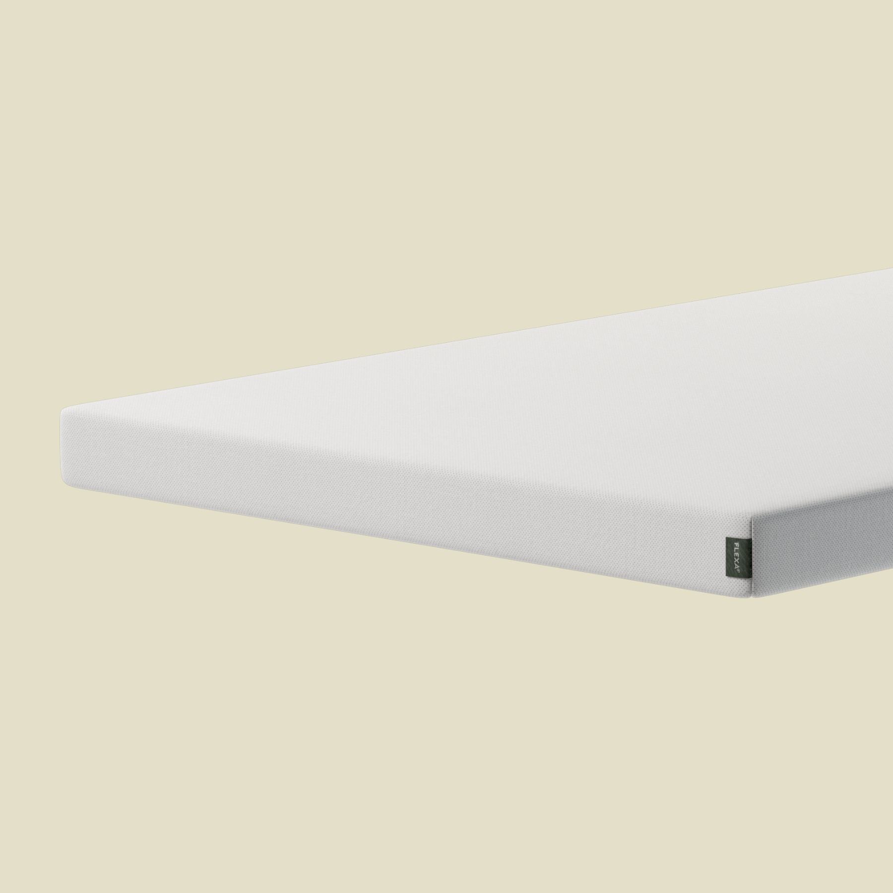 FLEXA DREAM white foam mattress, 200x120 cm, rectangular, on beige surface; visible as child-safe and hypoallergenic.